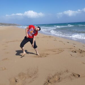 A photo of a dancer on a beach